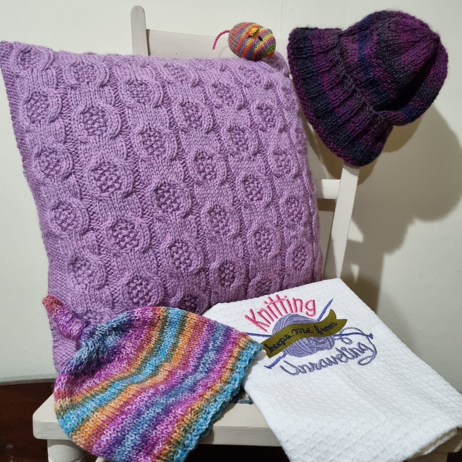 Selection of product displayed that are availble to buy at Bannockburn House. Cushions, hats, tea towels ,